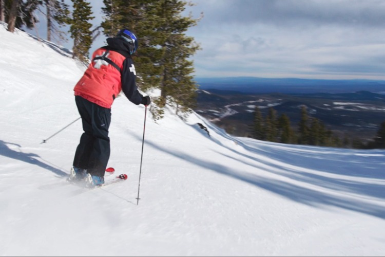 Man skiing down mountain