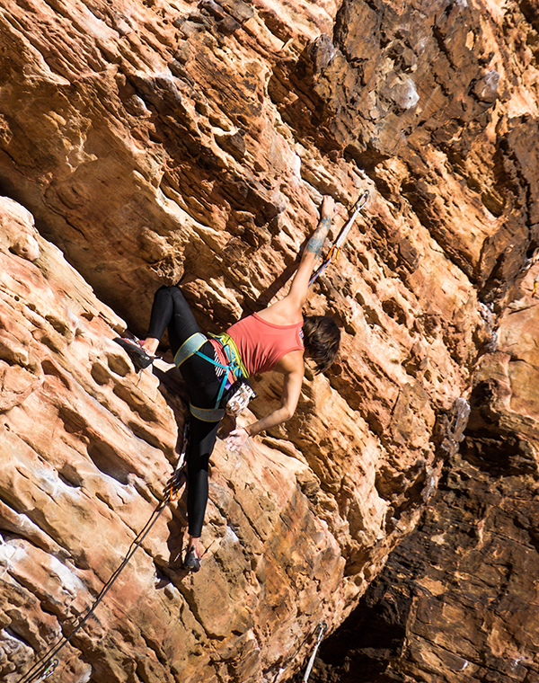 woman rock climbing outdoors